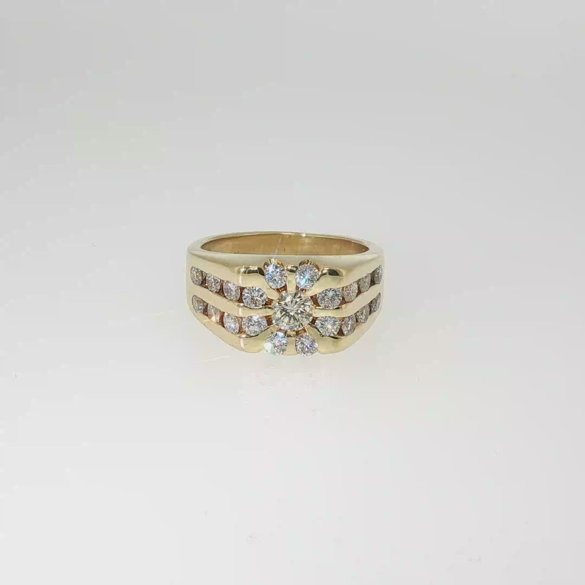 18K yellow gold multi-row band with 21 round brilliant diamonds in a channel-set design.