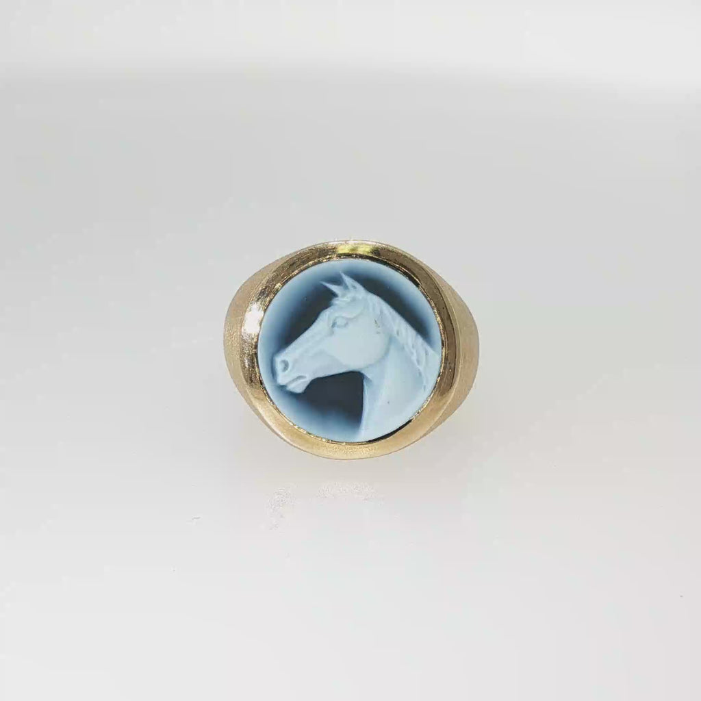 14K yellow gold ring with a round blue and white carved Wedgwood horsehead cameo.