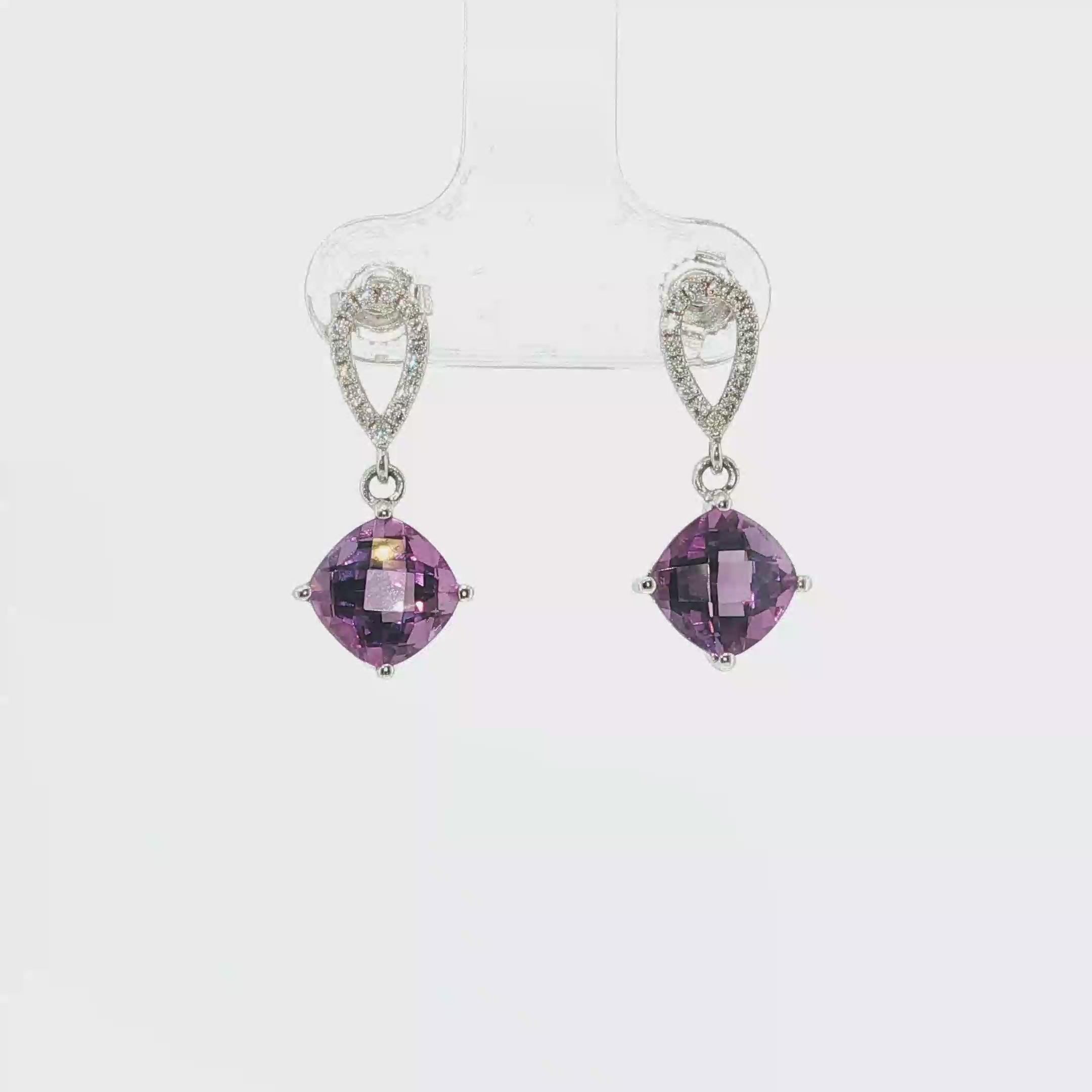 14K white gold amethyst and diamond drop earrings with two faceted purple amethysts and diamond-accented tops.