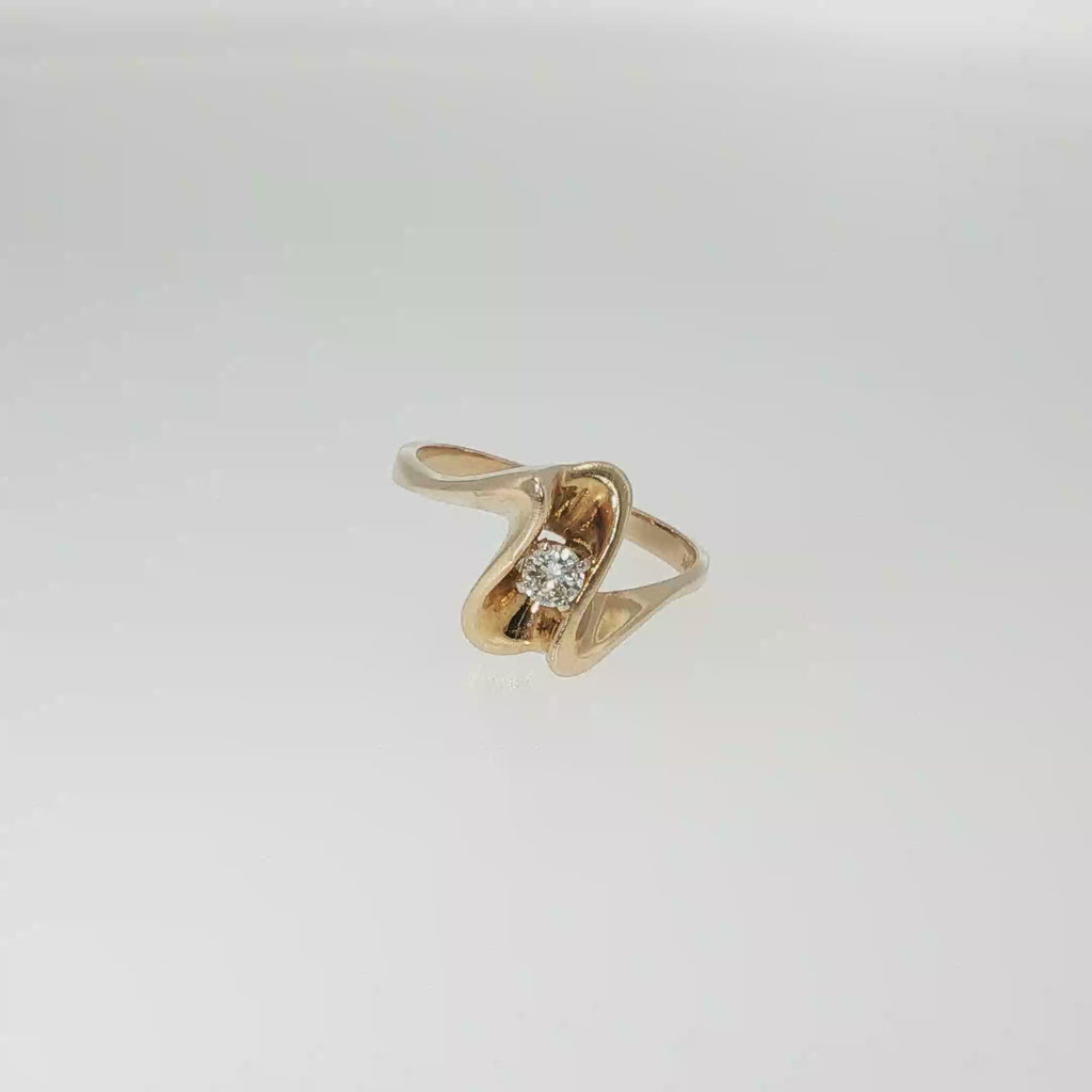 14K yellow gold freeform ring with a single round brilliant diamond in a sculptural asymmetrical design.