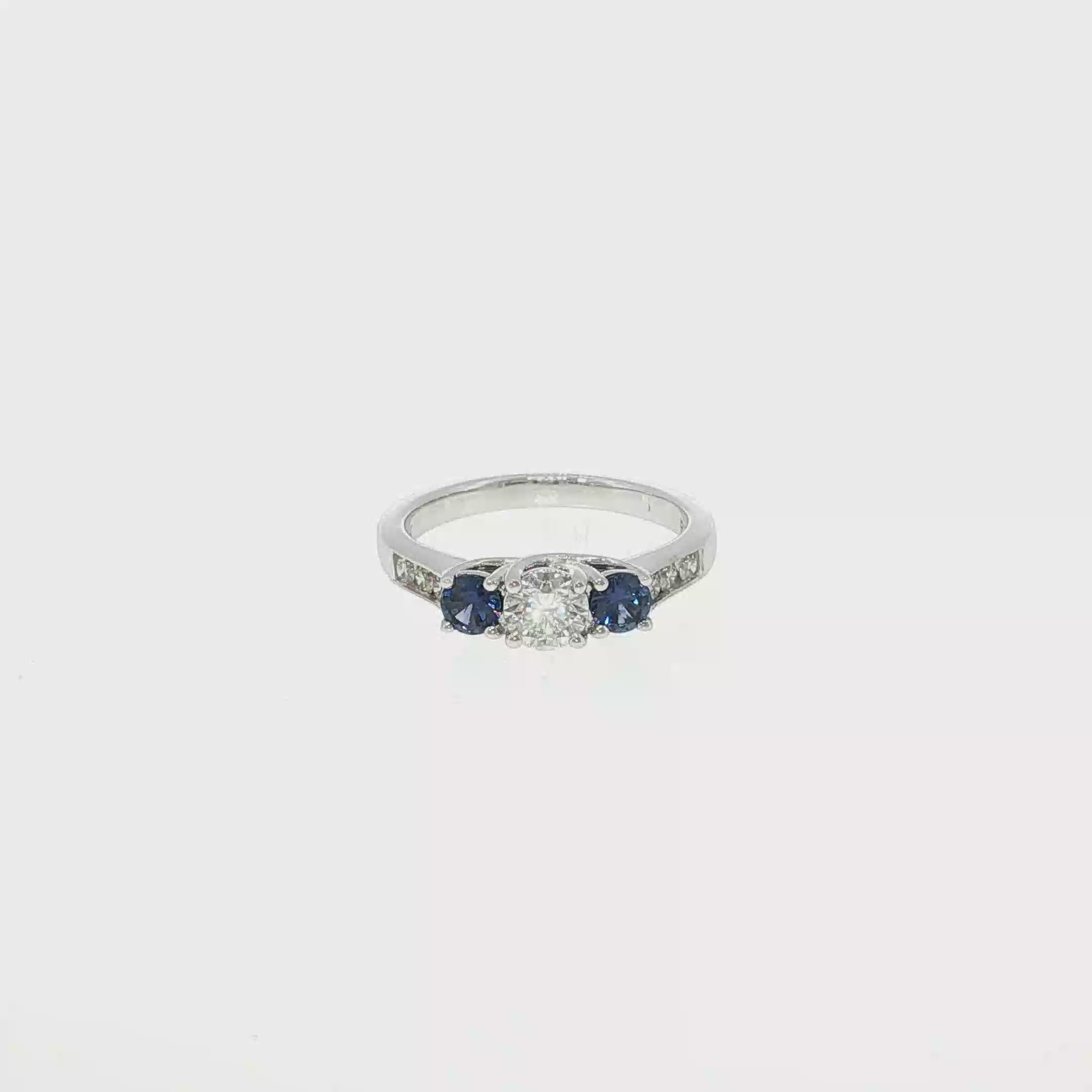 Round Diamond and Montana Yogo Sapphire Three-Stone Ring