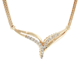 14K yellow gold V-shaped necklace with round brilliant diamond accents on a foxtail chain.