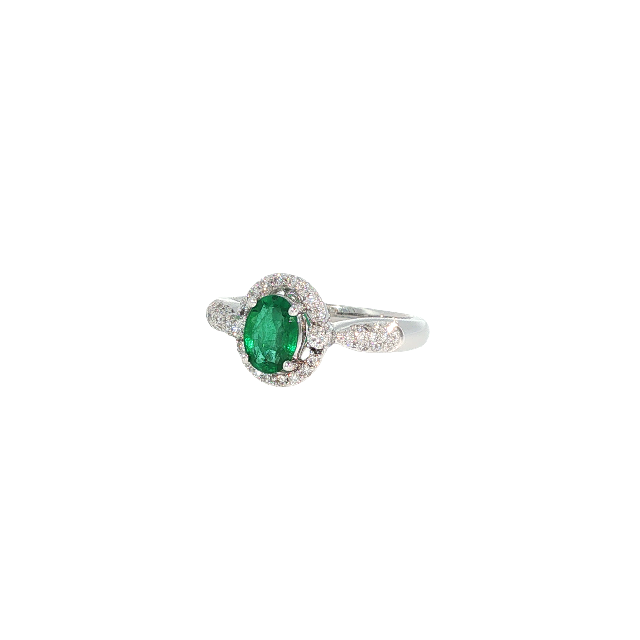 14K white gold ring with an oval green emerald surrounded by a halo of round diamonds.