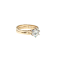 14K yellow gold cathedral bridal set with a round brilliant center diamond and matching soldered wedding band.